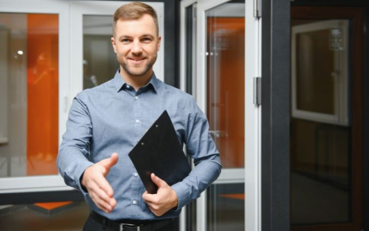 A successful and confident salesperson greeting someone.